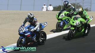 2007 AMA Supersport - Serious Racing T8: Gotta Love AMA Racing; Martin Cardenas #361 is looking at Ben Attard just out of frame making a bonzai pass on these 3 riders, while Steve Rapp #15 is taking a ride through the gravel trap and Roger Hayden #95 is trying to win the championship.